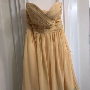 Yellow Bill Levkoff knee length bridesmaid dress